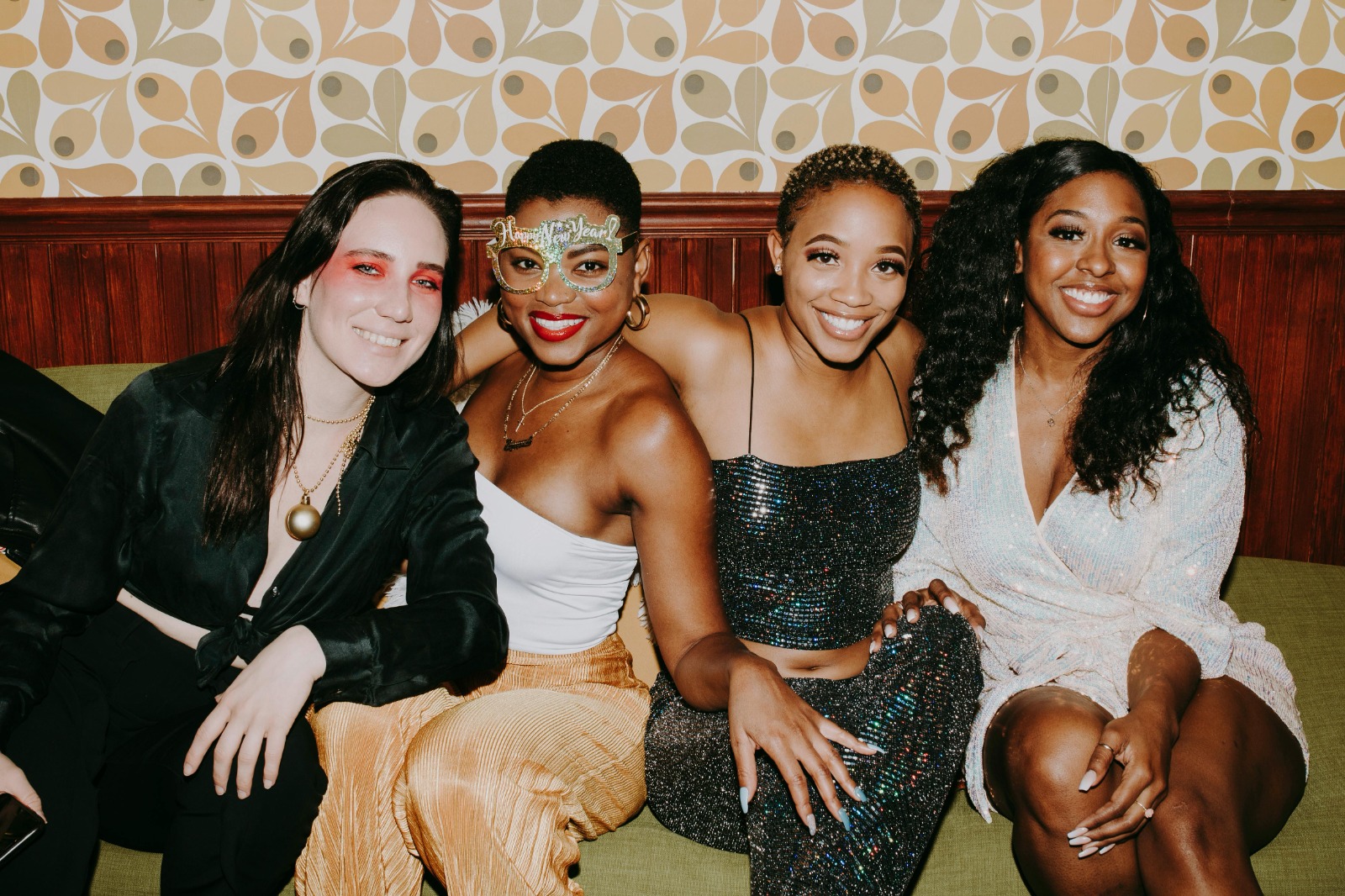 Group of friends laughing together on the beach